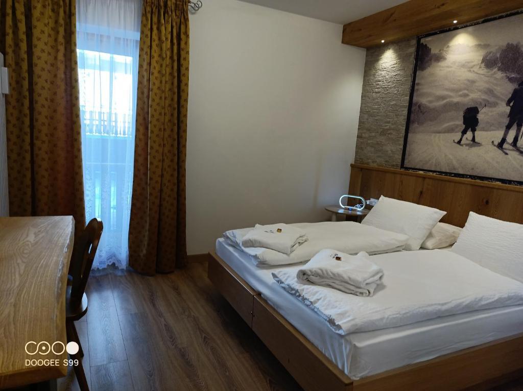 5denní zájezd (denní přejezd) s dopravou, polopenzí a skipasem v ceně – hotel Arnica